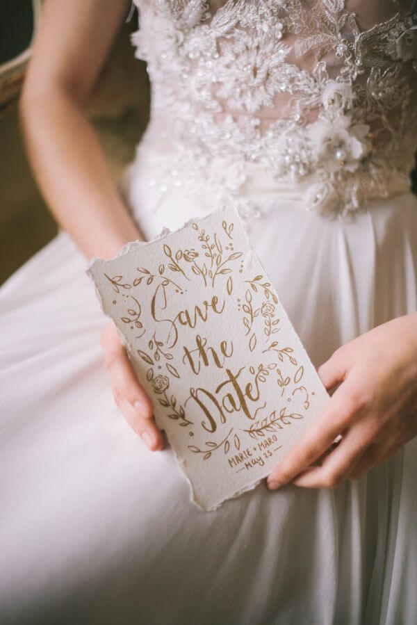 Bride holding a save the date
