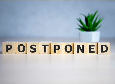 Letter blocks spelling postponed